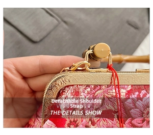 Detail of red floral embroidery bag with bamboo handle and detachable strap hook