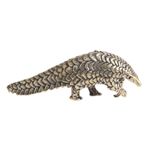 Miniature vintage brass pangolin figurine with detailed scales for desktop decor