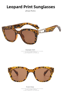 Detail view of square leopard print sunglasses with brown lenses and silver metal hinges