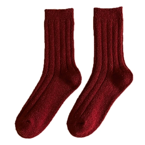 Thick warm dark red ribbed knit socks for Christmas and New Year festive season