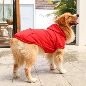 Detail view of the red pet hoodie with functional zipper pocket and adjustable drawstring