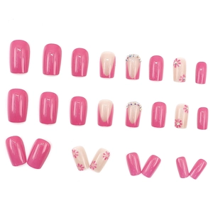 Hot pink and nude press-on nail set with floral patterns and sparkling rhinestones