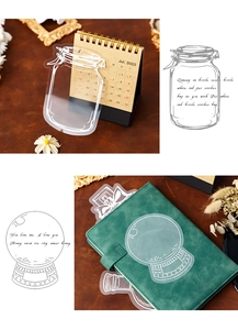 Detail of transparent PET stickers showing glass bottle designs on a vintage calendar