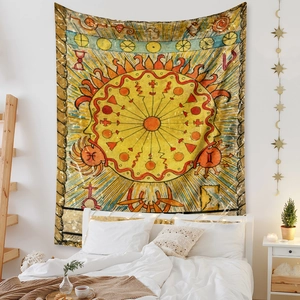 Detail of bohemian tapestry with mystic patterns hanging on a cozy bedroom wall