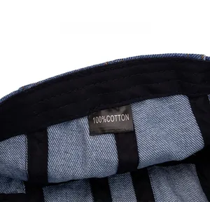 Detail of the 100% cotton wash label and inner black reinforced tape on denim beret