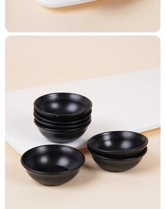 Miniature black matte ceramic bowls stacked for dollhouse kitchen and food play scenes