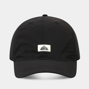Close-up of quick-dry baseball cap featuring a white O.Y.X mountain logo patch
