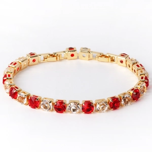 Detail of 6mm gold tennis bracelet featuring alternating red and clear square-cut zircons