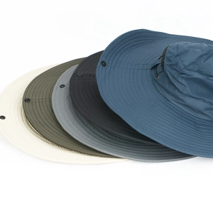 Close-up of quick-dry fishing hats in various colors with mesh vents and chin straps