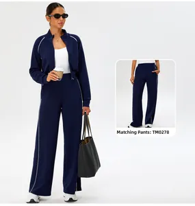Detail of dark blue yoga set featuring contrast white stripes on slim jacket and wide-leg pants