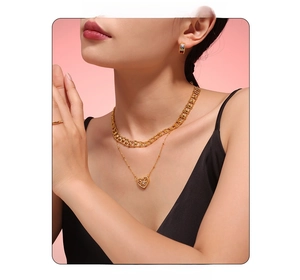 Close-up of double-layer gold heart necklace set with colorful earrings and rings