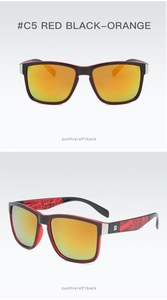 Detail view of sporty rectangular sunglasses with black-red frames and orange mirrored lenses