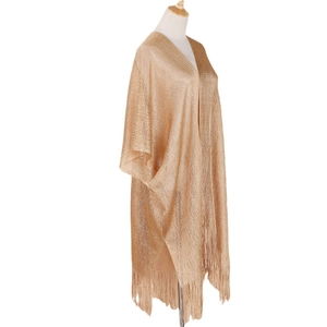 Sparkling gold shawl for women featuring woven texture and decorative tassel details