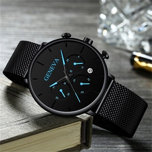 Detail of black mesh strap quartz watch with blue hands on a book cover scene