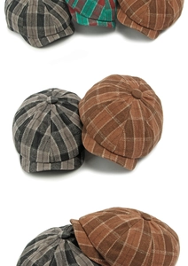 Detailed close-up showing plaid patterns and texture of retro newsboy caps in multiple colors
