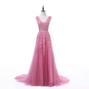 Detail of pink evening gown with floral lace bodice and layered tulle maxi skirt