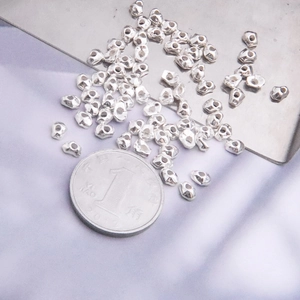 Macro view of irregular S925 sterling silver loose beads for DIY jewelry making