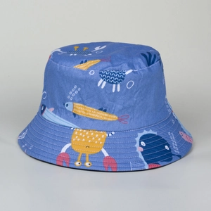 Close-up of blue bucket hat with cartoon ocean fish print and herringbone cotton texture