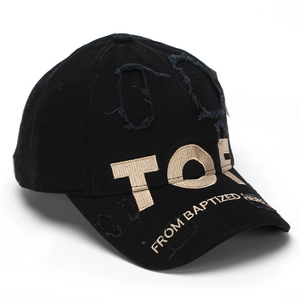 Detailed macro view of retro black baseball cap with TOR 3D embroidery and distressed holes