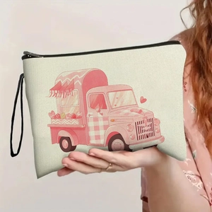 Portable beige canvas makeup bag with pink ice cream truck print and black wrist strap