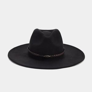 Detail of wide brim fedora hat featuring a brown woven leather band and oval metal buckle