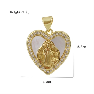 Macro detail of a 3.2g gold-plated heart cross pendant with shell inlay and zircons