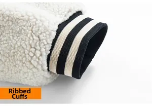 Detail of striped ribbed cuffs on an off-white sherpa fleece winter jacket