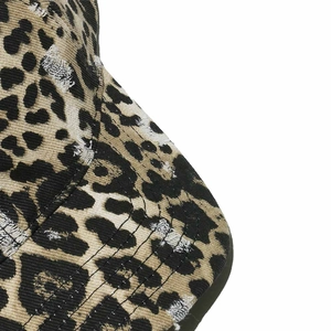 Detailed macro view of distressed leopard print baseball cap with frayed edge stitching