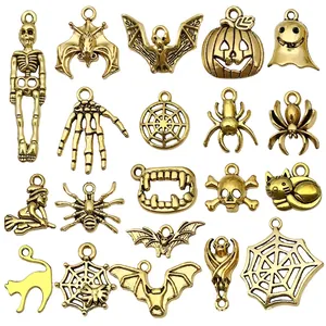 Antique gold Halloween charms set featuring skulls, bats, and pumpkins for DIY jewelry