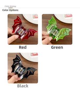 Detailed view of Halloween bat hair claws in red, green and black marble finish