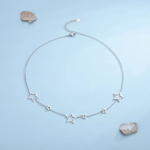 Minimalist silver stainless steel star necklace featuring hollow star pendants and lobster clasp