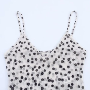 Chic white mesh V-neck camisole with black polka dots and delicate thin straps