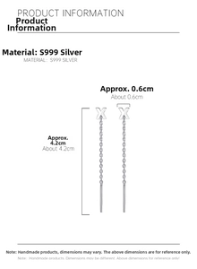 Detail view of S999 sterling silver pull-through earrings showing 4.2cm length and X-shape