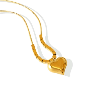 Minimalist gold heart pendant necklace with snake chain and square bead accents