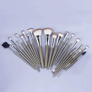 Professional 23-piece makeup brush set with silver ferrules and gray handles on purple background