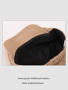 Detail of khaki kids beret showing inner lining and elastic band for size adjustment