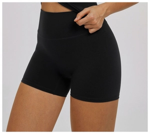 Close-up of high-waisted black yoga shorts showing elastic fabric texture and fit