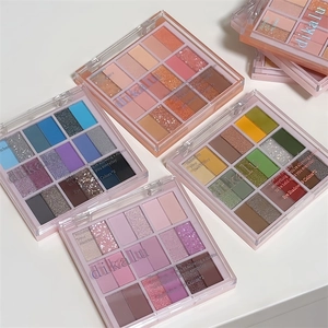 Detailed overhead view of 18-color eyeshadow palettes in transparent acrylic cases