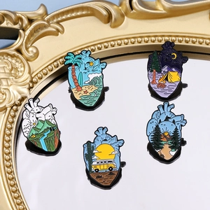 Exquisite set of 5 heart-shaped enamel pins featuring diverse natural landscape designs