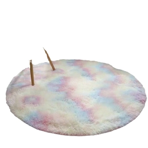 Round tie-dye plush rug in soft pink, blue and yellow tones for bedroom or living room