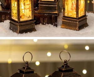 Detail of vintage Christmas lantern with snowman patterns and rustic metal ring handle