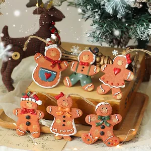 Set of 6 vintage gingerbread man resin ornaments with rustic twine hangers for Christmas decor
