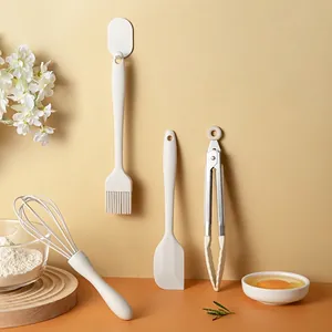 5-piece cream white silicone baking tool set including brush spatula whisk and food tongs