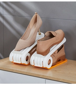 Detail view of adjustable double-layer plastic shoe organizer with non-slip base
