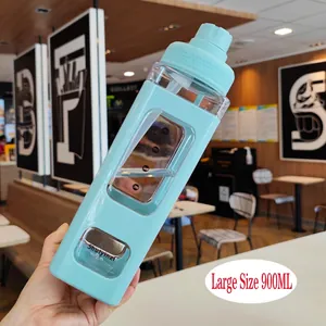 Detail of light blue 900ml square water bottle with volume scale and carry handle