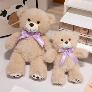 Plush teddy bear set with purple bows in cream faux fur for nursery decoration