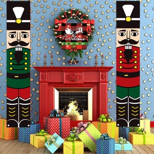 Close-up of nutcracker soldier porch banners and a festive Welcome wreath by a fireplace
