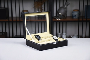 Detail view of 10-slot black PU leather watch display box with clear glass lid and soft pillows
