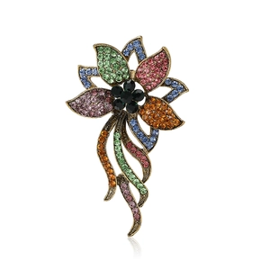 Vintage gold floral brooch with multicolored rhinestones and black gem centerpiece