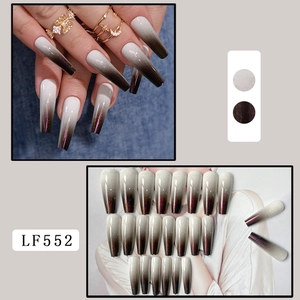 Macro view of long coffin press-on nails with grey-to-brown gradient and shimmer finish
